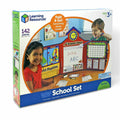 Blue box for a 142-piece school set showing children using a pop-up classroom with a whiteboard, maps, and clock.