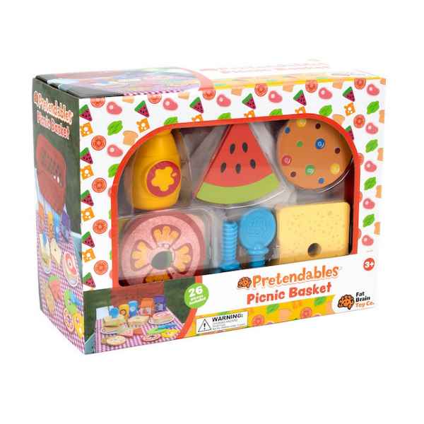 Colorful box of wooden play food pieces including watermelon, cheese, and a cookie visible through a clear window.