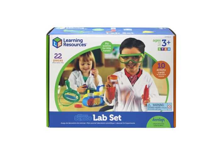 Blue and white box showing kids in lab coats using colorful science equipment, labeled 22 pieces and ages 3 plus.