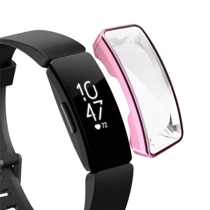 Pink protective case for Fitbit Inspire HR watch, made by That Watch Shop, shown on a black fitness tracker in an outdoor setting.
