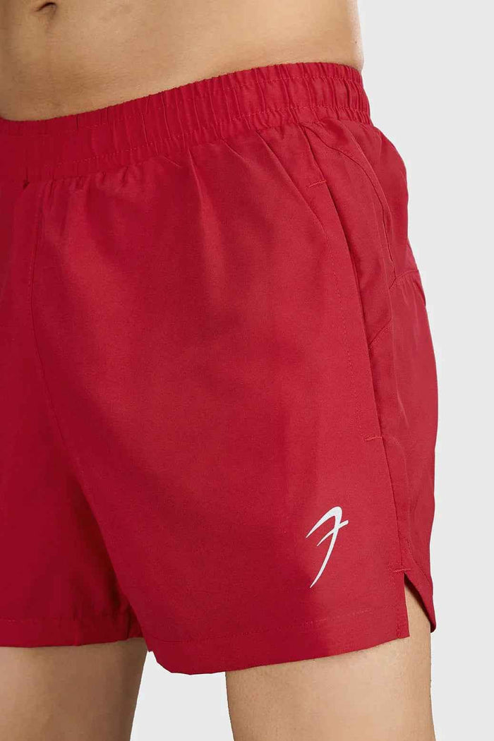Red Pulse 4-inch running shorts by Fuaark NZ, lightweight and comfortable athleisure wear, shown on a model.