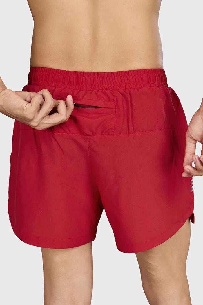 Red Pulse 4-inch running shorts by Fuaark NZ, lightweight and comfortable athleisure wear, shown on a model.