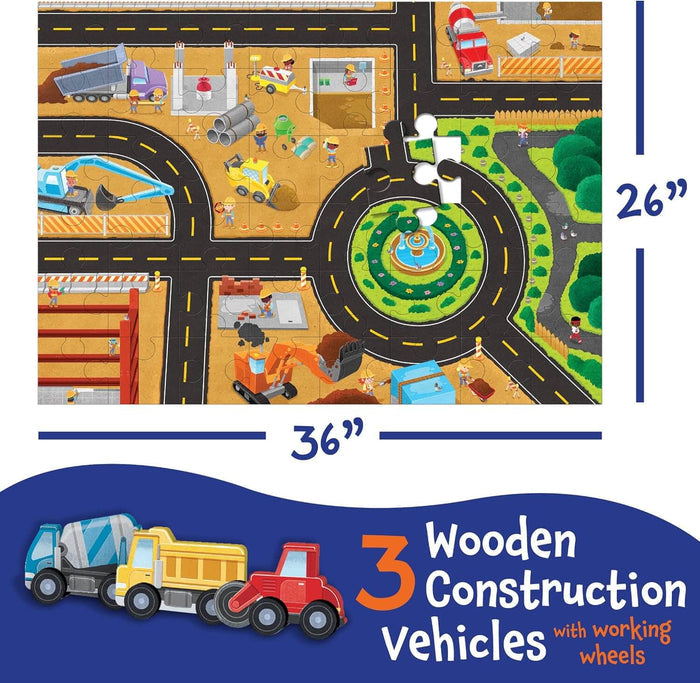36x26 inch floor puzzle of a busy construction site with roads, including three wooden toy trucks with rolling wheels.