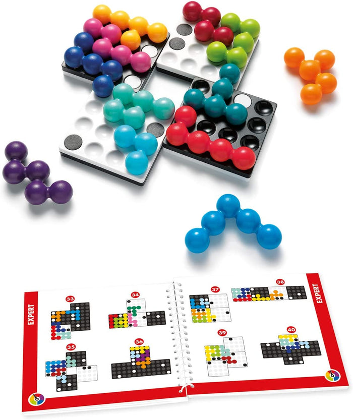 Colorful sphere-shaped puzzle pieces on four magnetic grid boards with an open expert challenge booklet.