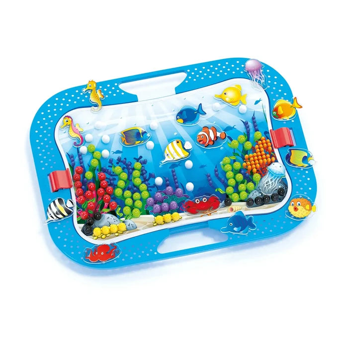 Blue ocean-themed peg board featuring colorful sea creature figures and bright pegs forming coral reef scenes.