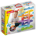 Product packaging for a 7-level rainbow zig-zag ramp toy with small flip cars and a young boy playing.