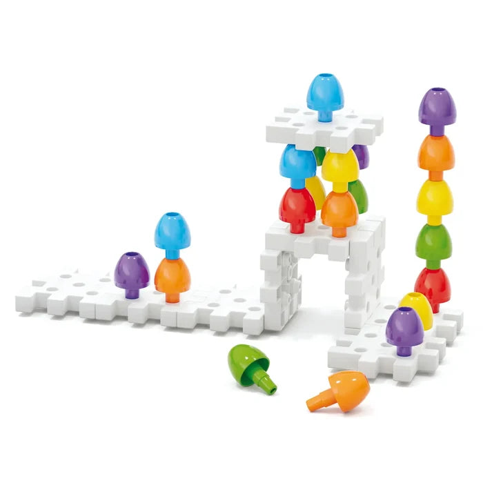 Colorful mushroom-shaped pegs stacked on white interlocking base plates to create various structures.