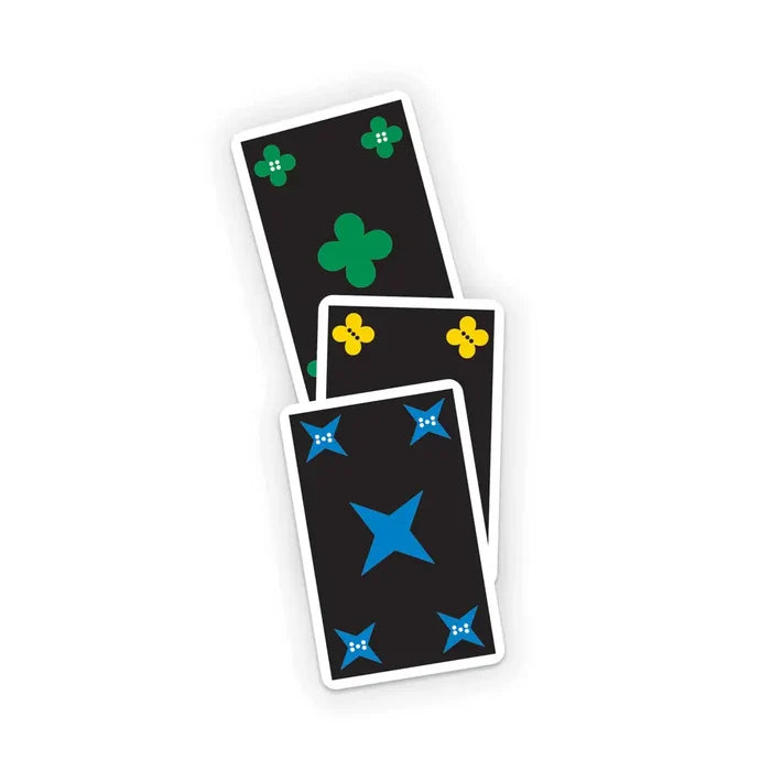 Three black cards with green clovers, yellow clovers, and blue stars, each featuring unique white dot patterns.