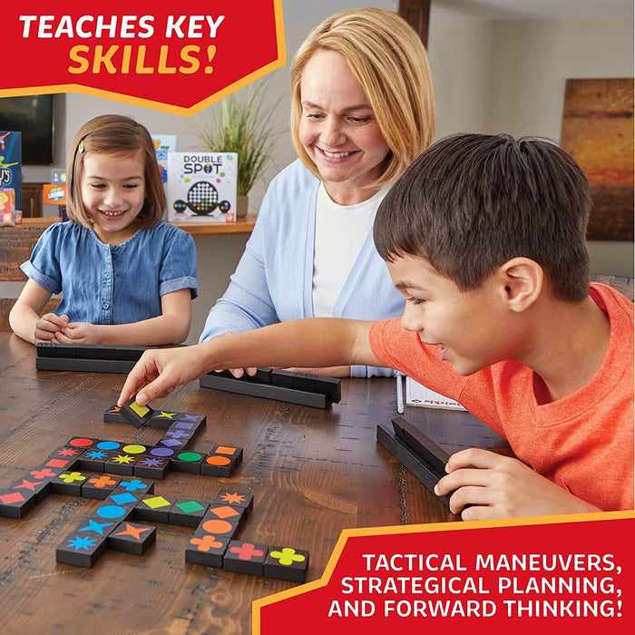 Woman and two children playing a board game with black square tiles featuring colorful geometric shapes.