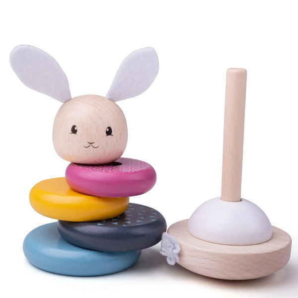 Wooden stacking toy with blue, grey, yellow, and pink rings, a rabbit topper, and a wooden base with a central pole.