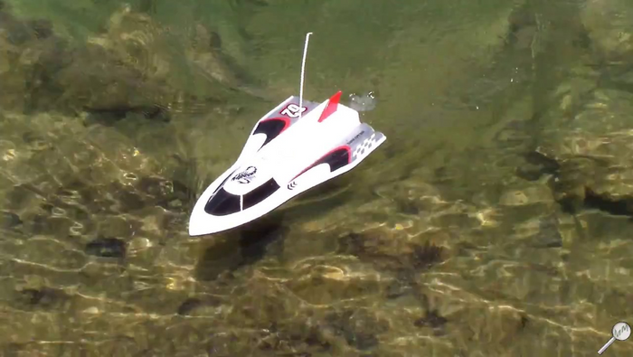 Red and black 40cm RC racing boat by DealOnline, high-powered speedboat with sleek design and detailed hull visible in the image.