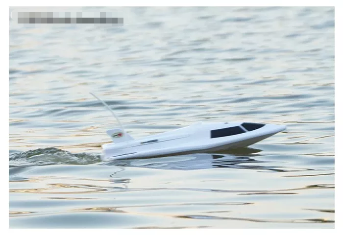 High-powered 40cm racing RC boat by dealonline.co.nz, sleek design, detailed features, ready for high-speed water racing.