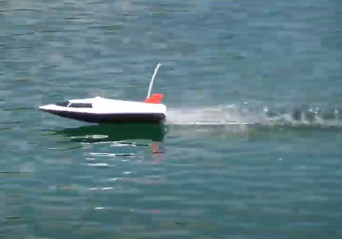 High-powered 40cm RC racing boat by dealonline.co.nz, sleek design, vibrant colors, and detailed features for fast water racing.