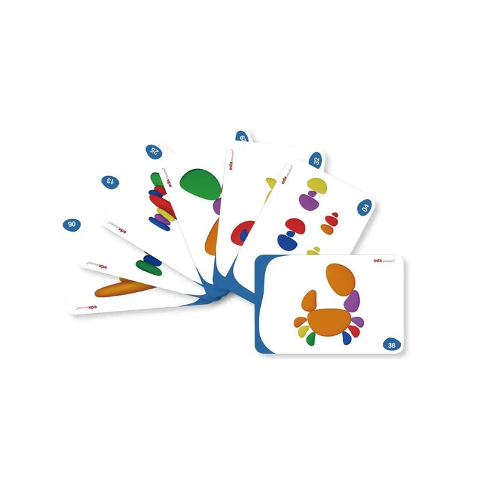 Fan of white activity cards showing smooth, multi-colored pebble shapes and a crab design on a white background.