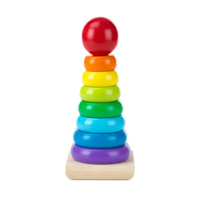 Wooden toy with seven rainbow-colored rings and a red ball topper on a rectangular light wood base.