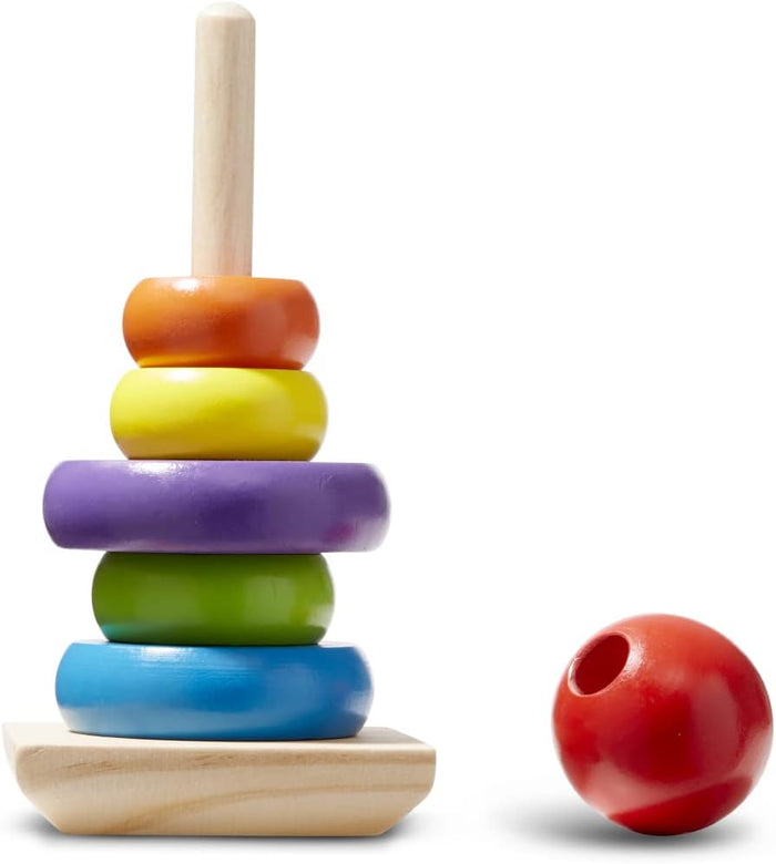 Wooden stacking toy with blue, green, purple, yellow, and orange rings on a pole and a red ball topper to the side.
