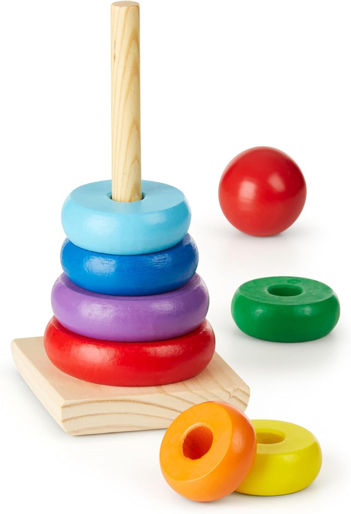 Wooden toy with colorful rings stacked on a pole and green, orange, and yellow rings and a red ball topper nearby.