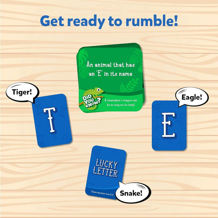 Blue letter cards and a green category card on wood with speech bubbles naming animals like Tiger and Eagle.