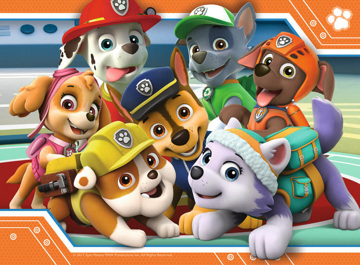Vibrant group portrait of smiling Paw Patrol puppies in a huddle, framed by a bright orange paw print border.