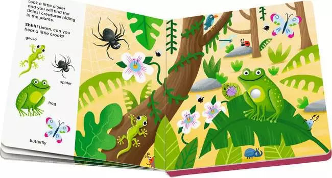 Open children's picture book showing a bright green frog, gecko, and spider in a lush, colorful jungle illustration.