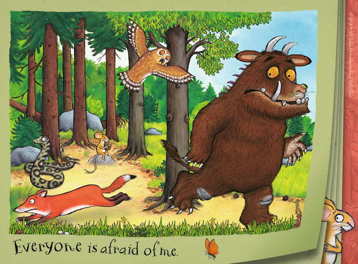 Brown Gruffalo walks through a forest as a fox, owl, and snake flee. Text: Everyone is afraid of me.