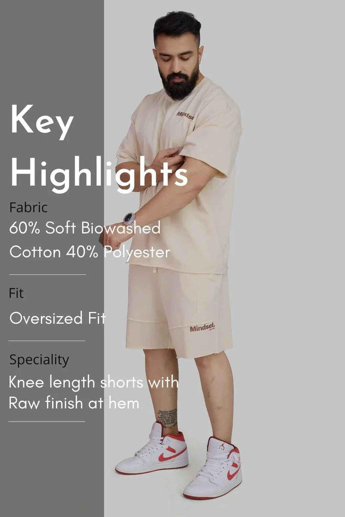 Beige raw edge oversized shorts by Fuaark Nz, featuring a relaxed fit and casual style perfect for warm weather.