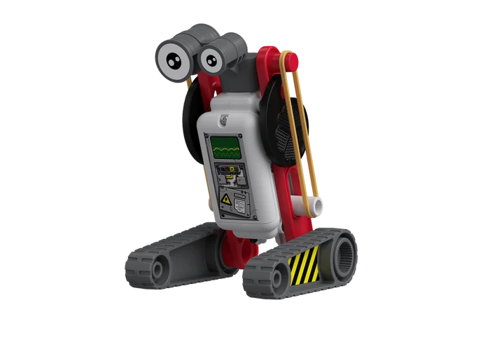 Small toy robot with a white body, red frame, grey tank treads, and big googly eyes, featuring yellow rubber bands.
