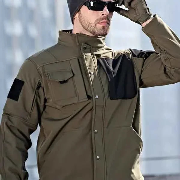 Green Rhino 2.0 Tactical Softshell Jacket for Men by Mead's Supply & Equipment Outfitters, showcasing durable outdoor apparel.
