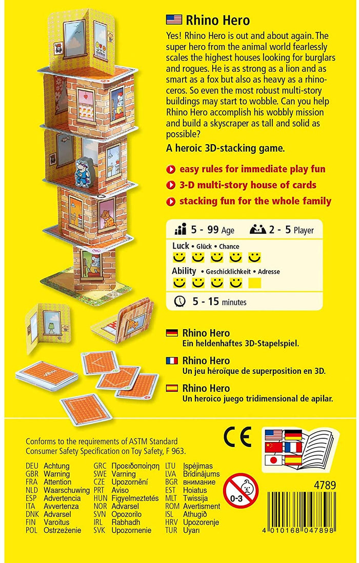 Back of a bright yellow game box featuring a tall, illustrated card tower with a small rhinoceros figure on a ledge.