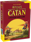 Red Catan game box featuring gold text and an illustration of figures with flags near a village at sunset.