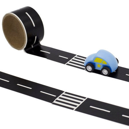 Black tape with white road lines and crosswalks, unrolled with a small blue toy car placed on top.