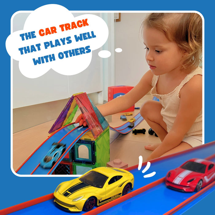 Girl playing with blue flexible two-lane car track with orange rails, toy cars, and colorful magnetic building tiles.