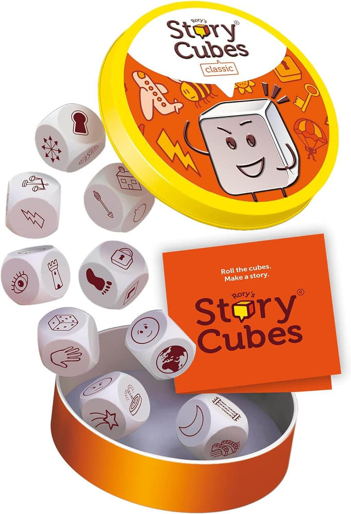 Nine white dice with assorted icons beside a round orange and yellow tin with a cartoon character lid.