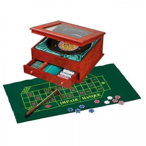 Polished wood roulette box with glass lid, open drawer, green betting mat, chips, and a croupier's rake.