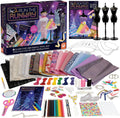 Fashion design kit with colorful fabrics, 3 mannequins, sketchbook, and tools next to a purple and black product box.