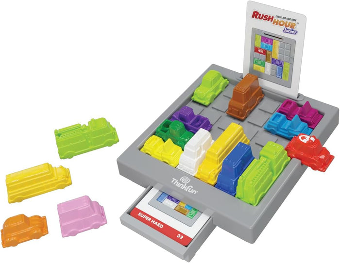 Colorful toy cars and trucks on a gray grid board with a red ice cream truck, challenge cards, and a storage drawer.
