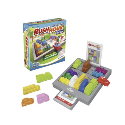 Rush Hour Jr. logic game box and gray tray with colorful plastic toy cars, trucks, and challenge cards.