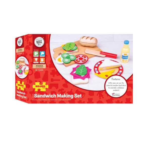 Red box featuring colorful wooden play food like bread, lettuce, and tomato slices with a toy knife and cutting board.