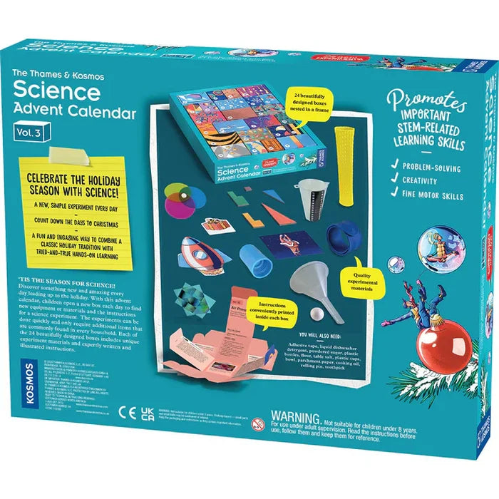 Teal Science Advent Calendar Vol. 3 box featuring 24 colorful boxes, lab tools, and a toy rocket in a holiday theme.