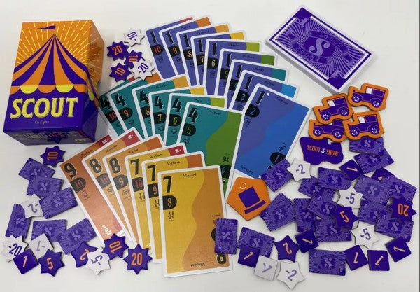 Yellow and purple circus-themed box with colorful numbered cards and various star and car-shaped game tokens.
