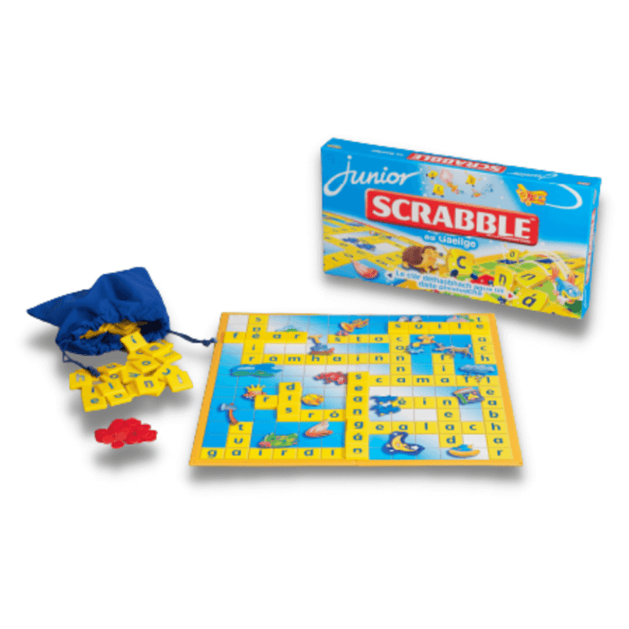 Irish Scrabble Junior game with colorful board, yellow letter tiles, blue drawstring bag, and red plastic tokens.