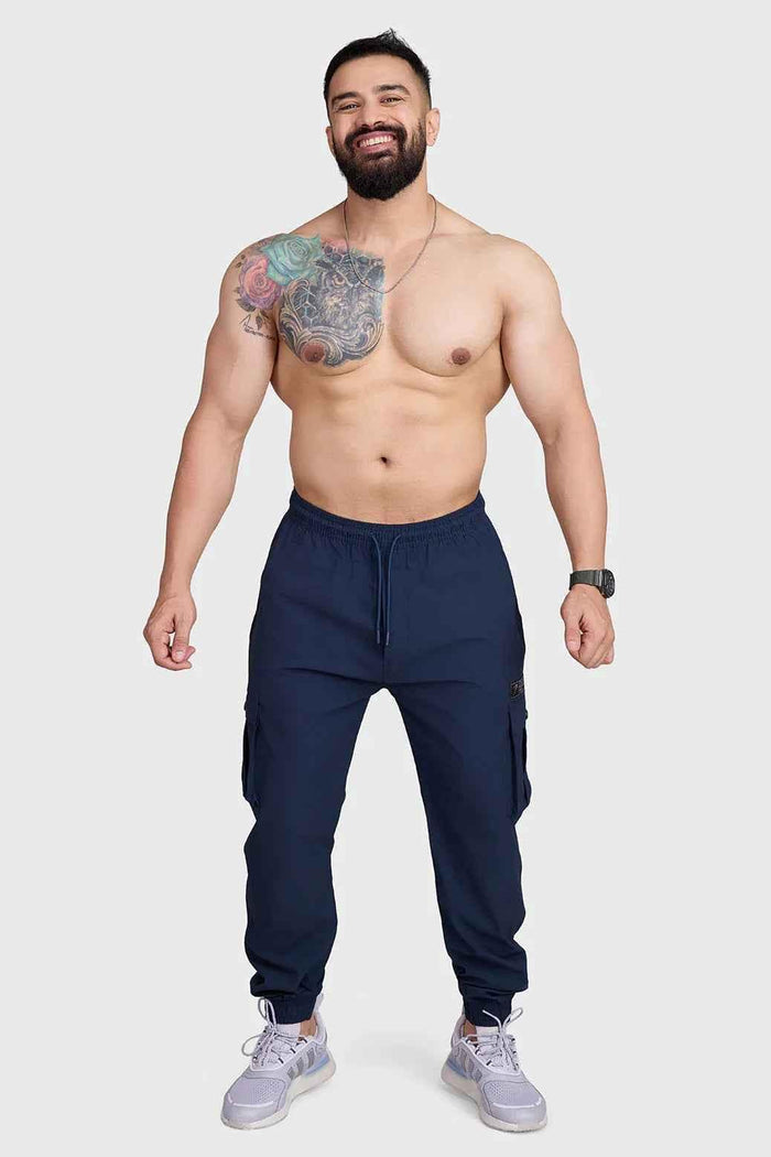 Dark navy Script Cargo Joggers by Fuaark Nz featuring a relaxed fit, multiple cargo pockets, and comfortable jogger style.