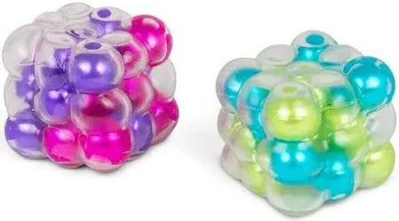 Two cube-shaped squishy toys made of many small, translucent bubbles in shades of pink, purple, blue, and green.