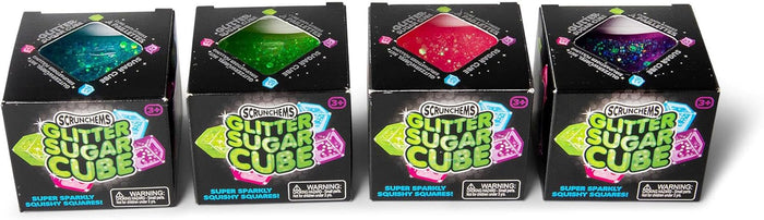 Four black boxes of teal, green, pink, and purple glittery squishy cubes seen through diamond-shaped windows.