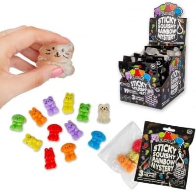 Small colorful bear and cat squishies shown with retail display box and black mystery blind pack packaging.