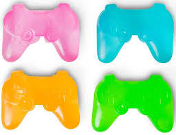 Four translucent squishy toys shaped like game controllers in pink, light blue, orange, and neon green.