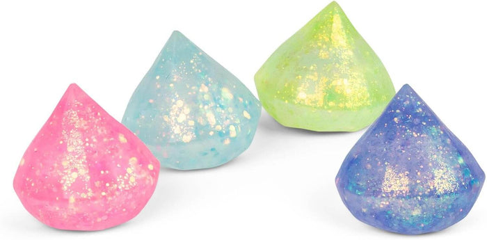 Four translucent diamond-shaped squishy toys with sparkly glitter in pink, light blue, lime green, and purple.