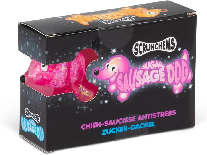 Glittery pink squishy dog toy in a black box with starry graphics and a dog-shaped cutout window.