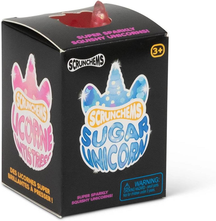 Black box with blue and pink unicorn graphics. A pink, sparkly squishy toy is visible through a cutout on the top.