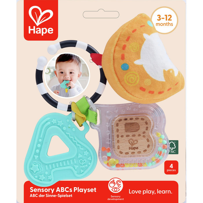 Hape baby toy: black and white ring, orange plush moon, teal letter A teether, and clear B rattle with colorful beads.